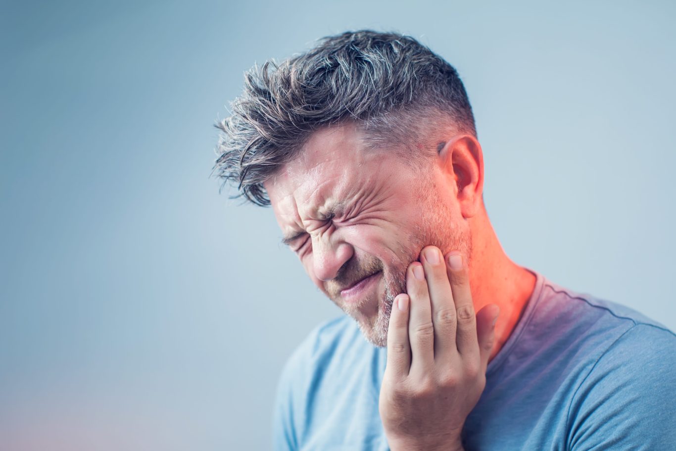 Man in Pain Holding His Jaw
